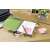 3M Post-it® Notes, assorted pastel colors, used on a notebook, planner, and desk