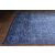 Conceptum Hypnose szőnyeg 150x230 Multicolor Dorian Chenille - Sötétkék AL 138, ferde nézet a kopott kék szőnyegről fapadlón