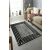 Conceptum Hypnose Carpet 140 x 220 Multicolor W1071 szőnyeg modern nappali környezetben, világos kanapéval és nagy ablakkal, bemutatva geometrikus mintázatát és élénk színeit