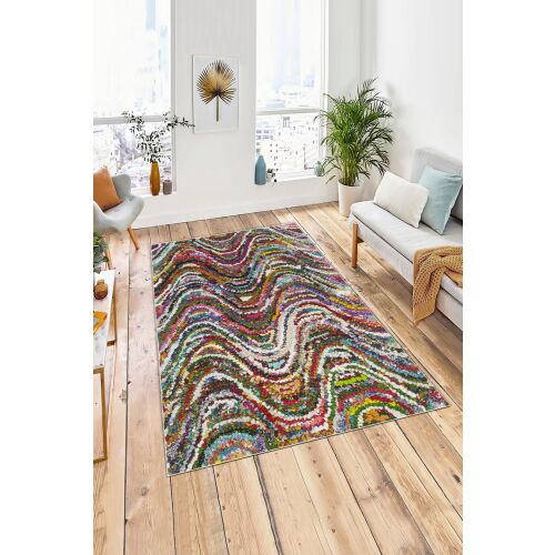 Conceptum Hypnose Multicolor W1180 szőnyeg 160 x 230 cm élénk hullámos absztrakt mintával modern nappaliban, nagy ablakokkal és növényekkel - Szőnyeg