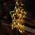 LED star window decoration, warm white, battery powered, hanging on wooden wall