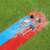 Two kids sliding down the Bestway H2OGO Tsunami Splash Ramp double lane water slide