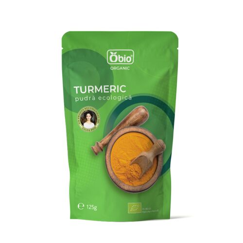 Obio bio kurkuma por 125g, zöld tasakban egy tál kurkuma porral és fa kanállal, ideális főzéshez és egészségügyi előnyökhöz - Élelmiszer és ital