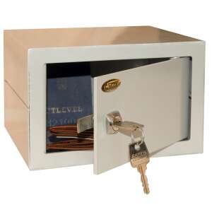 Champion small home safe with open door, showing interior space and keys - Security Safe