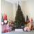 Springos 250 cm artificial Christmas tree, Caucasian spruce, decorated with ornaments and lights, in a room setting