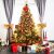 Decorated Springos Christmas tree with gifts and ornaments in a home setting