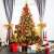 Springos 250 cm artificial Christmas tree, Caucasian spruce, decorated with ornaments and lights, in a room setting