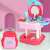 Pink vanity table toy with mirror, makeup, and hair accessories, in a suitcase, for kids