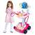 Child playing doctor with pink medical cart toy, EKG machine, stethoscope, and other accessories