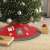 Red and gray Christmas tree skirt with Santa Claus, candy cane, and snowflake design