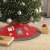 Red and gray Christmas tree skirt with Santa Claus, candy cane, and snowflake design