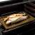 GrandCHEF fish holder stand with stuffed trout in oven