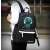 Kruzzel reflective backpack with USB and jack connector, black, worn by a person from the back