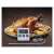 Emos digital cooking thermometer with probe, showing current and set temperature, used to measure the temperature of a roasted chicken