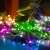 Somogyi Home colorful LED fairy lights wrapped around a plant and a blanket