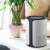 Home by Somogyi Air 18 WiFi Air Purifier, white, in a living room