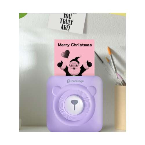 PeriPage Mini A6 imprimantă termică portabilă de culoare violet, imprimând un card de Crăciun drăguț