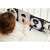 Baby playing with GaGaGu black and white developmental book with raccoon, sheep, cat and zebra