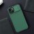Nillkin CamShield Pro green case for iPhone 13/14 on a desk