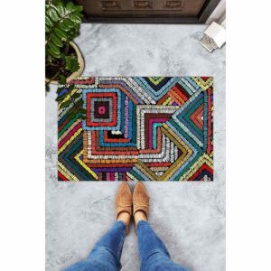 Colorful doormat with geometric pattern in use at the entrance - Doormat