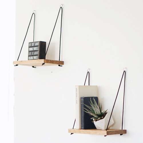 Two handmade wooden hanging shelves with black rope, wall mounted display shelves for books and plants.