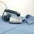 Ariete Duet Garment Steam Iron 6246, 2-in-1 garment steamer and iron, white and blue, in use on a shirt
