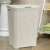 CURVER "Style" 60L Rattan Effect Laundry Basket, White, in bathroom setting