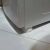 Ruhhy anti-vibration pad under washing machine, close-up view, floor protection