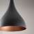 Close-up of Berceste black 1 ceiling lamp, showing the copper interior of the shade
