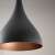 Close-up of Berceste black 1 ceiling lamp, showing the copper interior of the shade