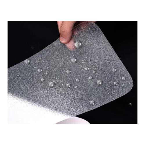 Close-up of clear anti-slip tape with water droplets, showing its waterproof and wear-resistant properties, safety, home, stairs, steps, grip, traction, prevent falls, easy to apply, durable, waterproof, wear-resistant