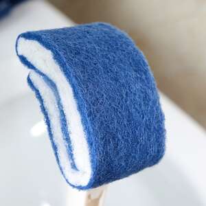 Close-up of the blue and white cleaning head of a toilet bowl cleaning brush - Cleaning brush