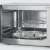 Inside of Severin MW7751 microwave oven showing turntable and grill rack