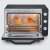Severin TO2073 Mini Oven, black, open door, bread inside