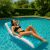 Woman relaxing on Intex inflatable pool lounge in swimming pool