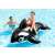 Child riding Intex inflatable dolphin rider, black and white, 193x119cm