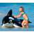 Child riding Intex inflatable dolphin rider, black and white, 193x119cm