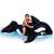 Child riding Intex inflatable dolphin rider, black and white, 193x119cm