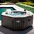 Intex PureSPA Jet & Bubble 4 person inflatable hot tub with salt system, 201x71cm, in a backyard setting