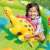 Child playing with yellow dinosaur in Intex inflatable dinosaur pool