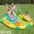 Kids playing in Intex inflatable dinosaur pool with slide and water sprinkler