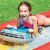 Intex Racing Fun inflatable water slide with child using surf car