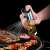 Hand holding oil and vinegar sprayer, spraying oil on grilled food
