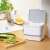 PURO Biohulladék tároló, white compost bin with grey lid and handle, kitchen waste container, in a kitchen setting