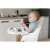 Ricokids Milo multi-functional high chair in grey color, showing a baby sitting in the chair