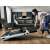 Woman unfolding G-Runner T60 Compact Folding Treadmill