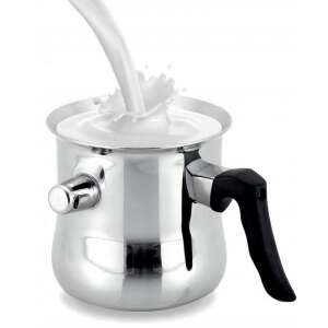 Milk being poured into a stainless steel milk frother - Cookware & bakeware