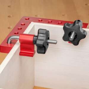 Red aluminum corner clamp with 90 degree angle, used to hold two pieces of wood together at a right angle - Clamp