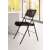 ALBA folding chair, black, metal and fabric, in use