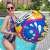 Bestway 31044 inflatable beach ball, 36 inches, colorful art design, woman playing in pool
